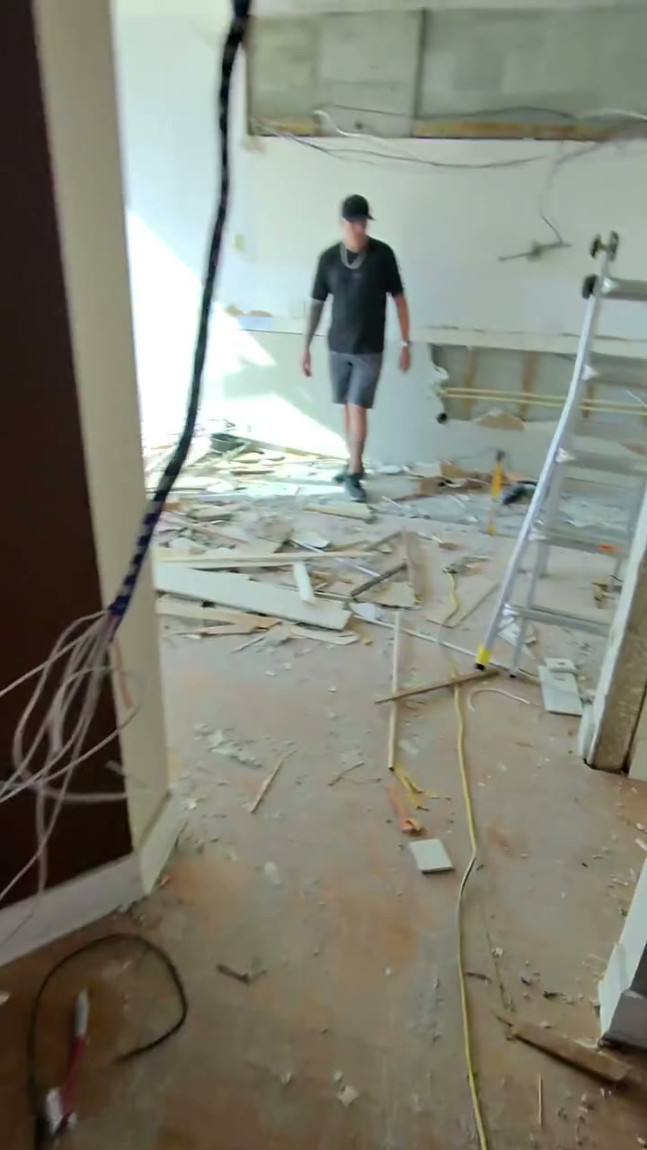 Excavator tearing down home during demolition