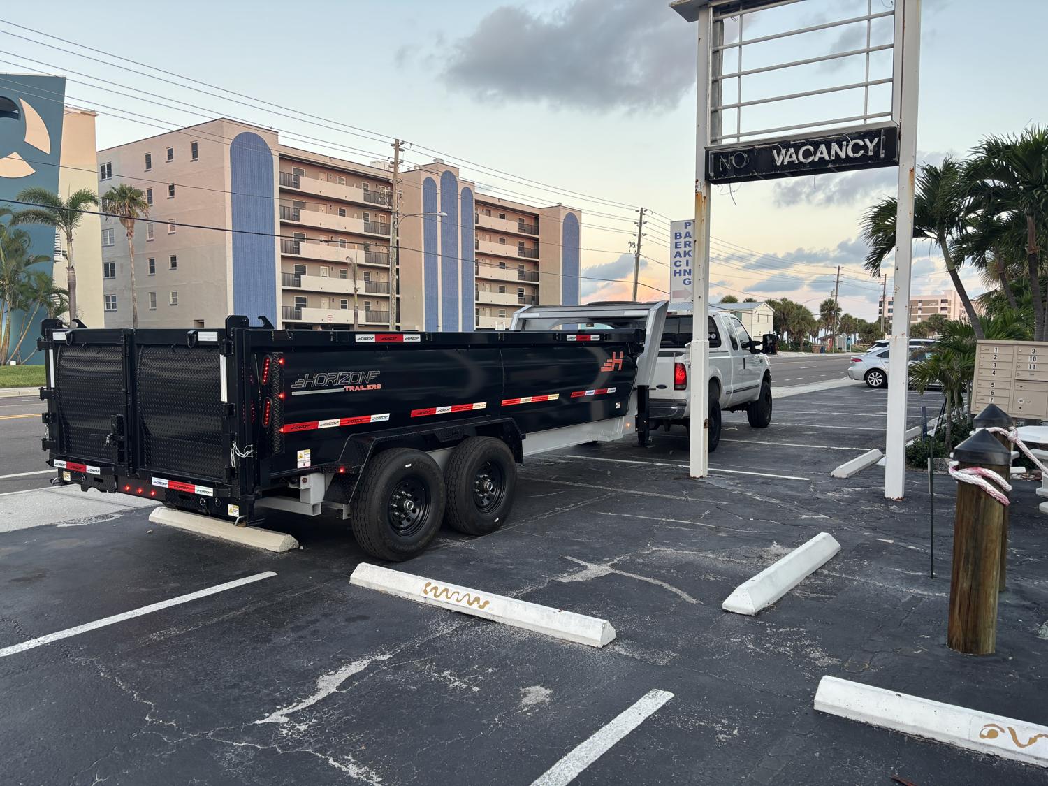 Griffin Demolition truck and dump trailer loaded for full debris haul-off in Tampa Bay